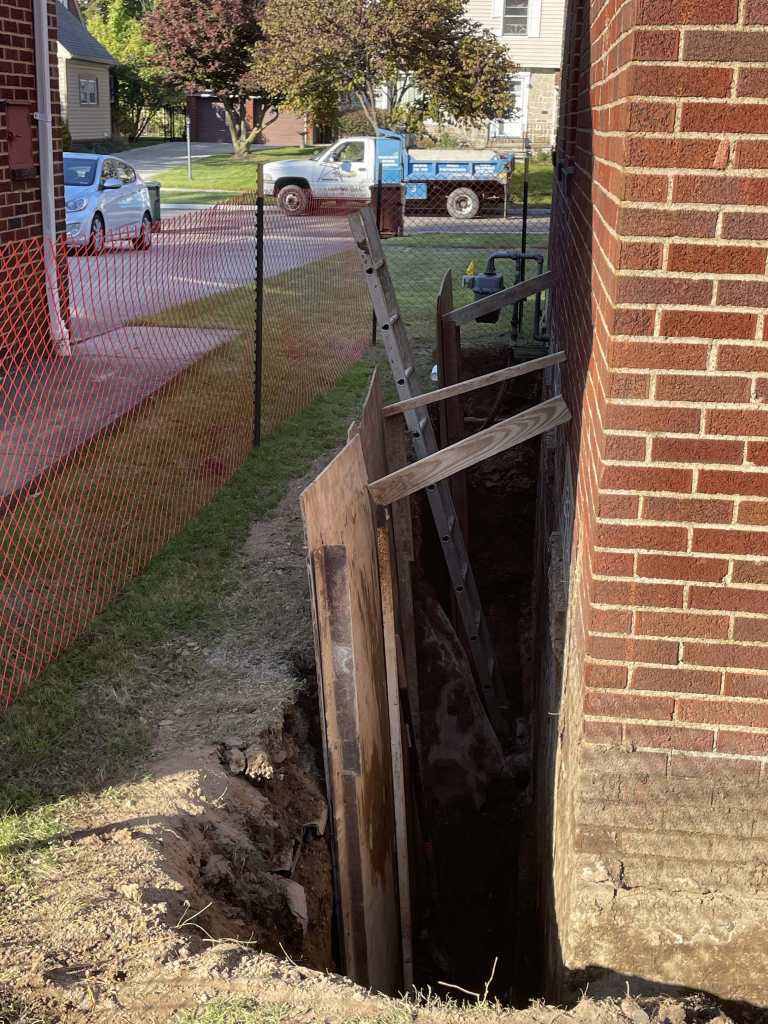 Excavation for basement waterproofing project