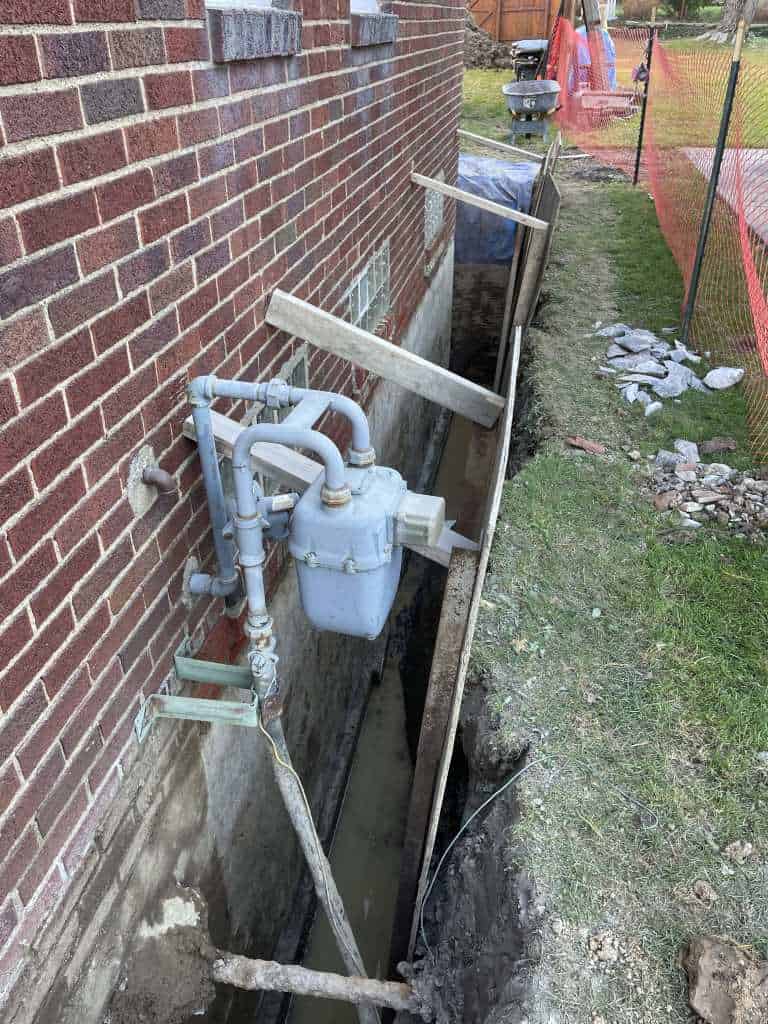 Excavation for basement waterproofing project