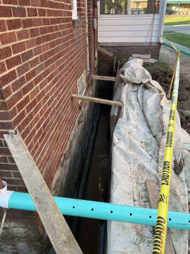 Excavation for basement waterproofing project