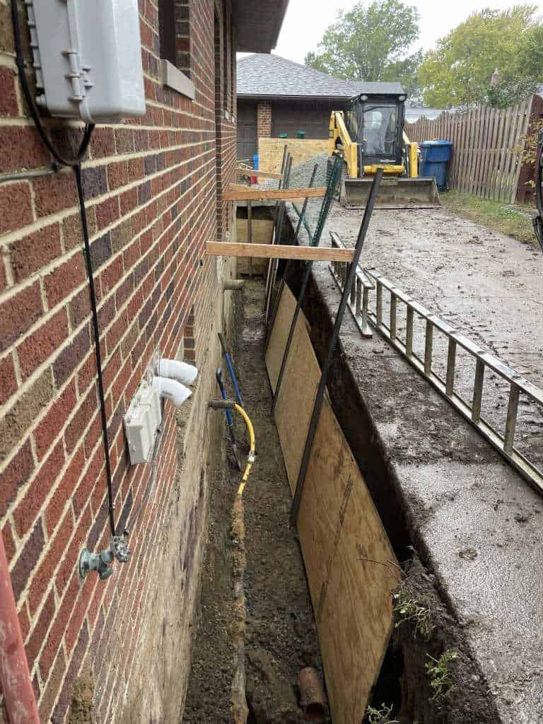 Excavation for basement waterproofing project