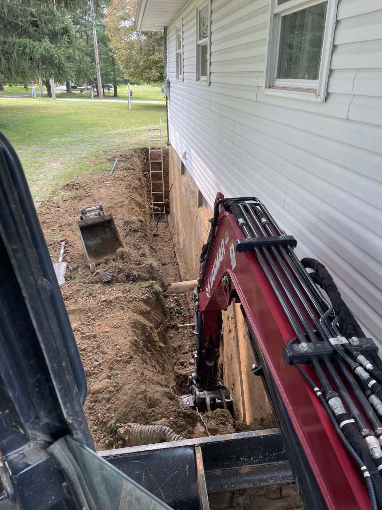 Excavation for basement waterproofing project
