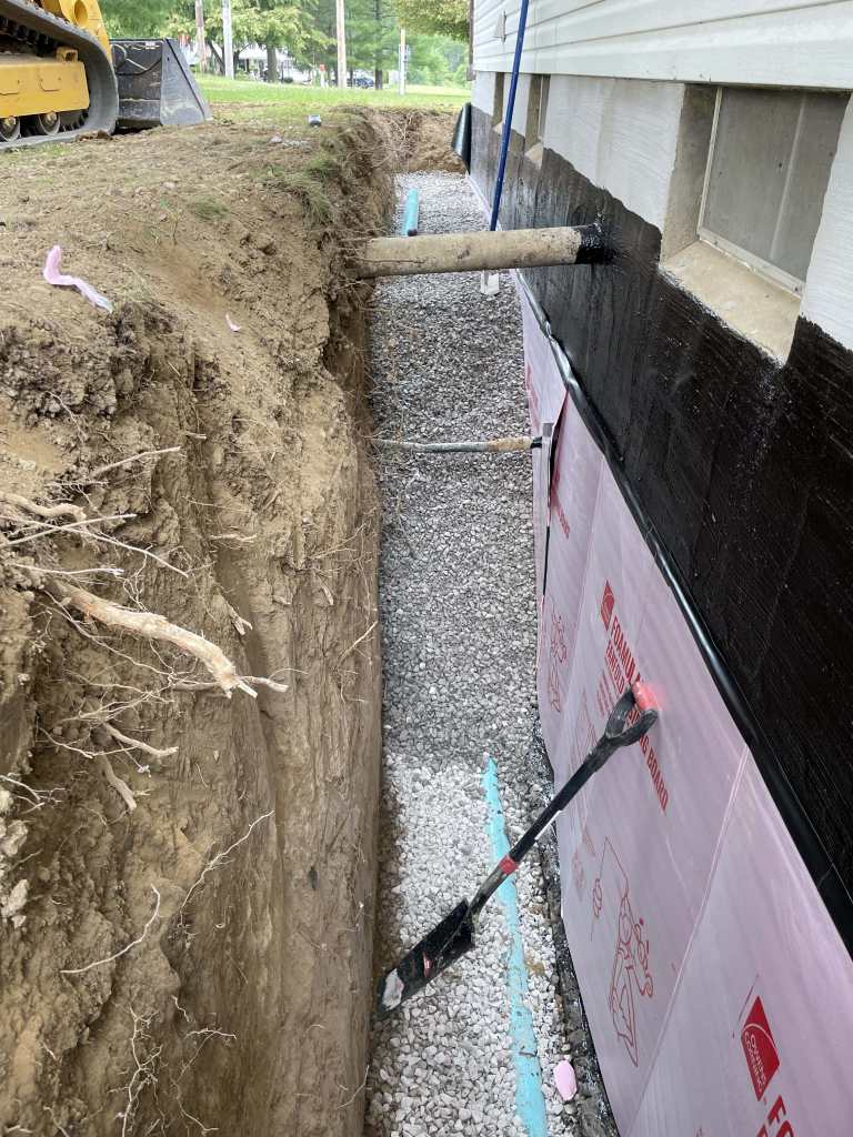 Excavation for basement waterproofing project