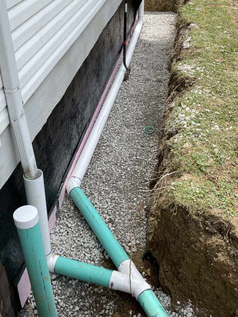 Drainage pipes along foundation trench