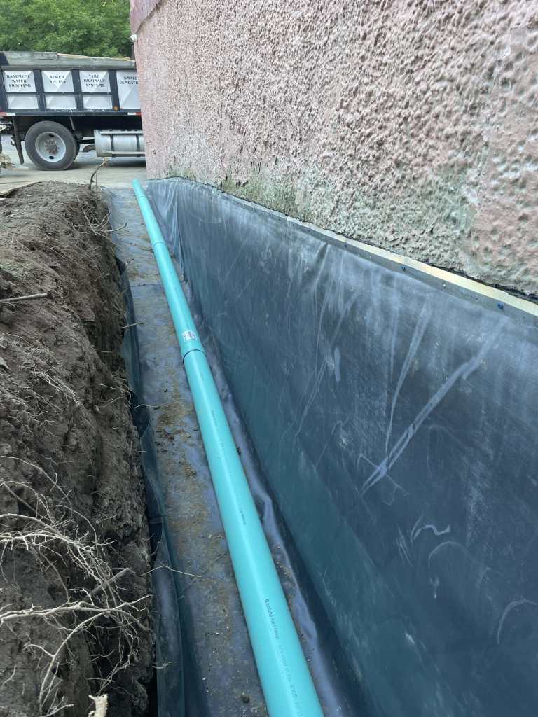 Trench with drainage pipe installation