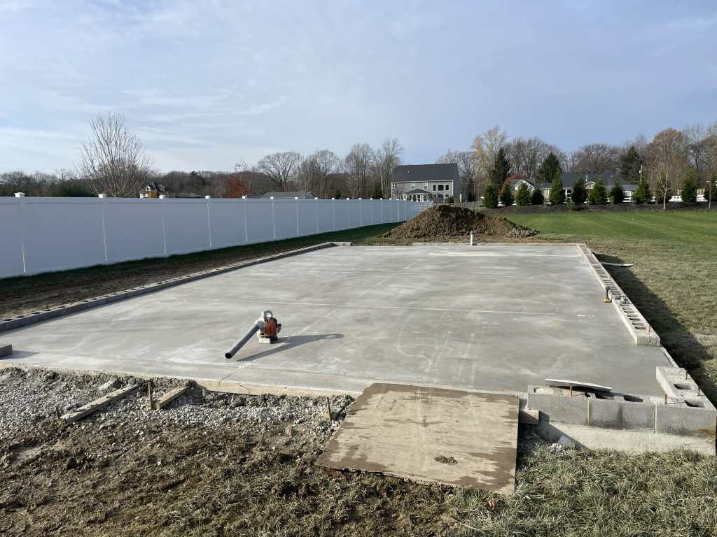Concrete foundation in open field