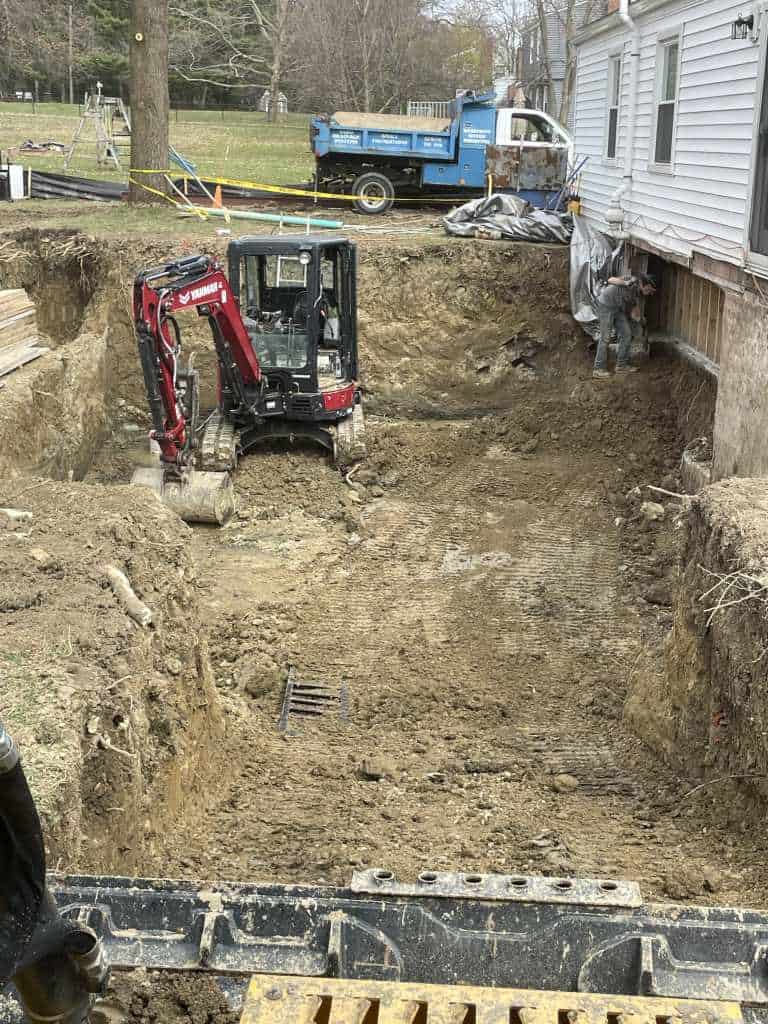 Excavation site with machinery and workers