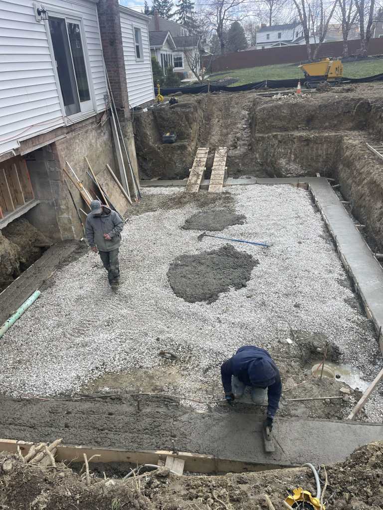 Construction site with gravel and workers