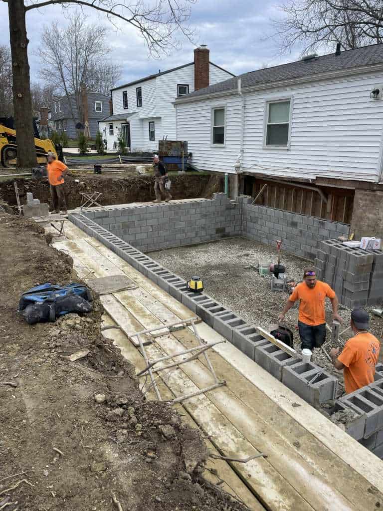 Construction workers building a foundation.