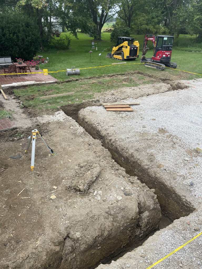 Excavation site with machinery and tools.