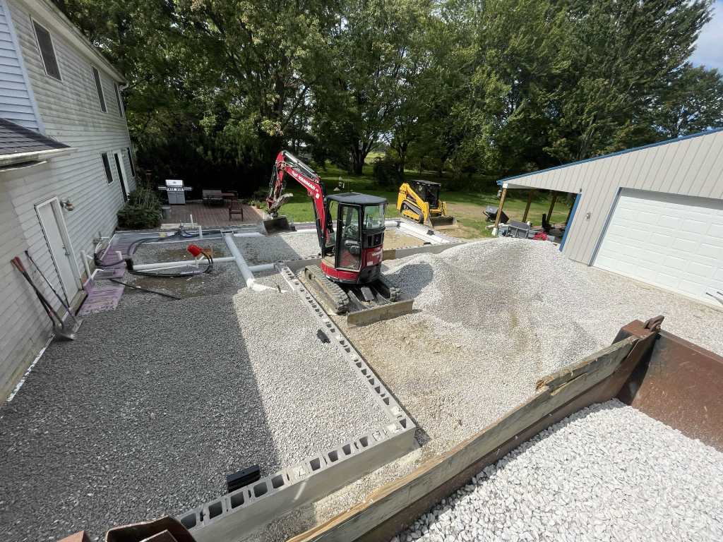 Excavation and gravel placement in yard