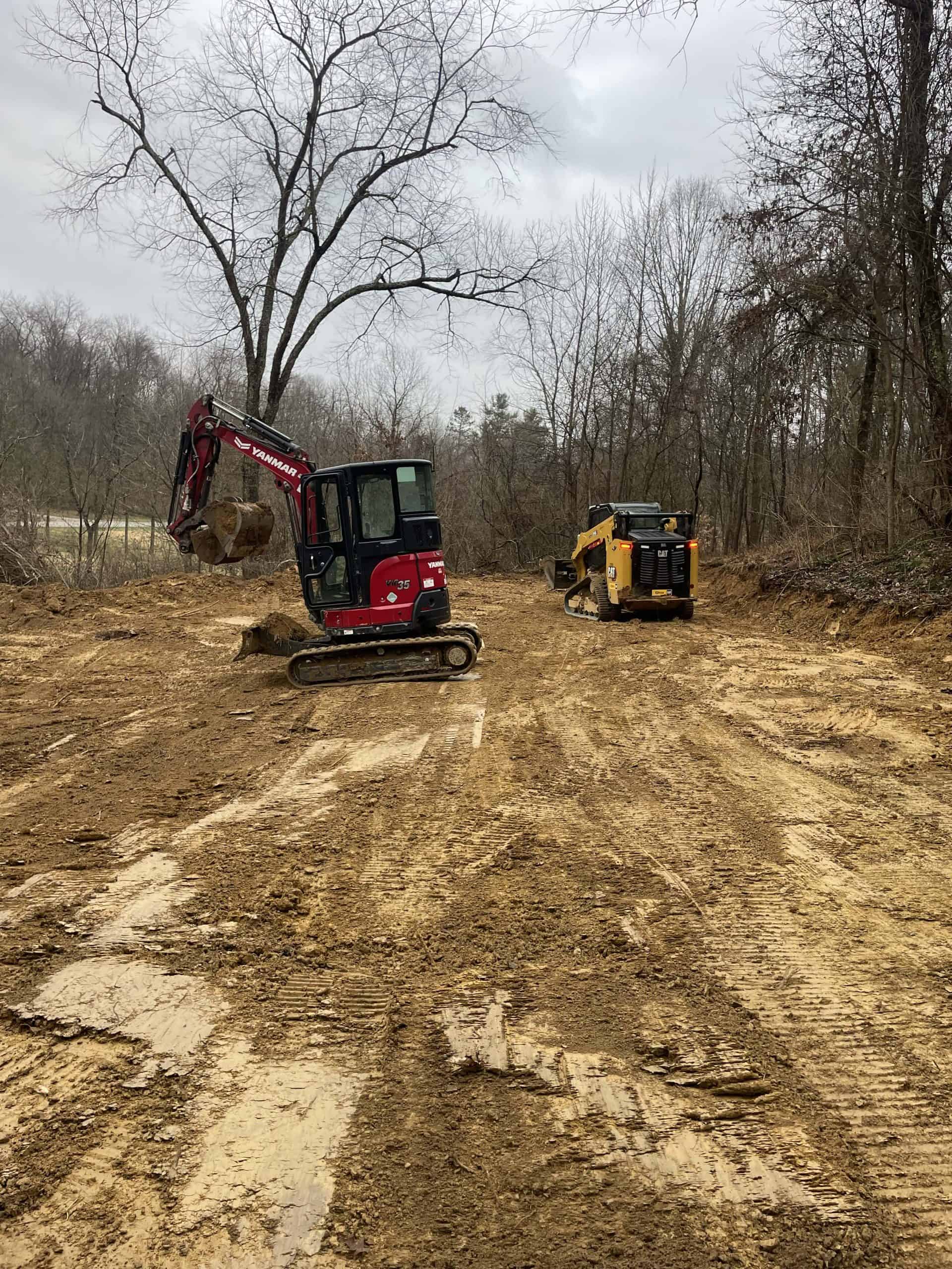 Excavators working on a cleared site.
