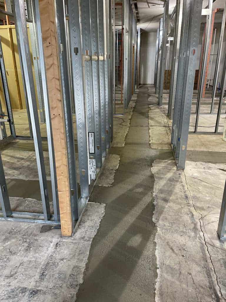 Concrete pathway in framed construction area