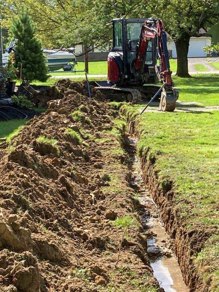 Excavation site with machinery and trench