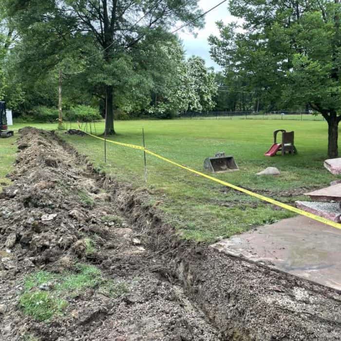 Excavation site with equipment and grass