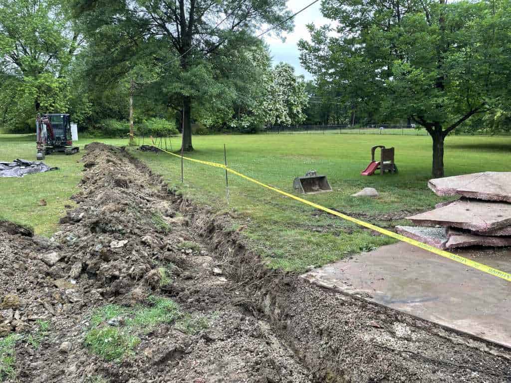 Excavation site with equipment and grass