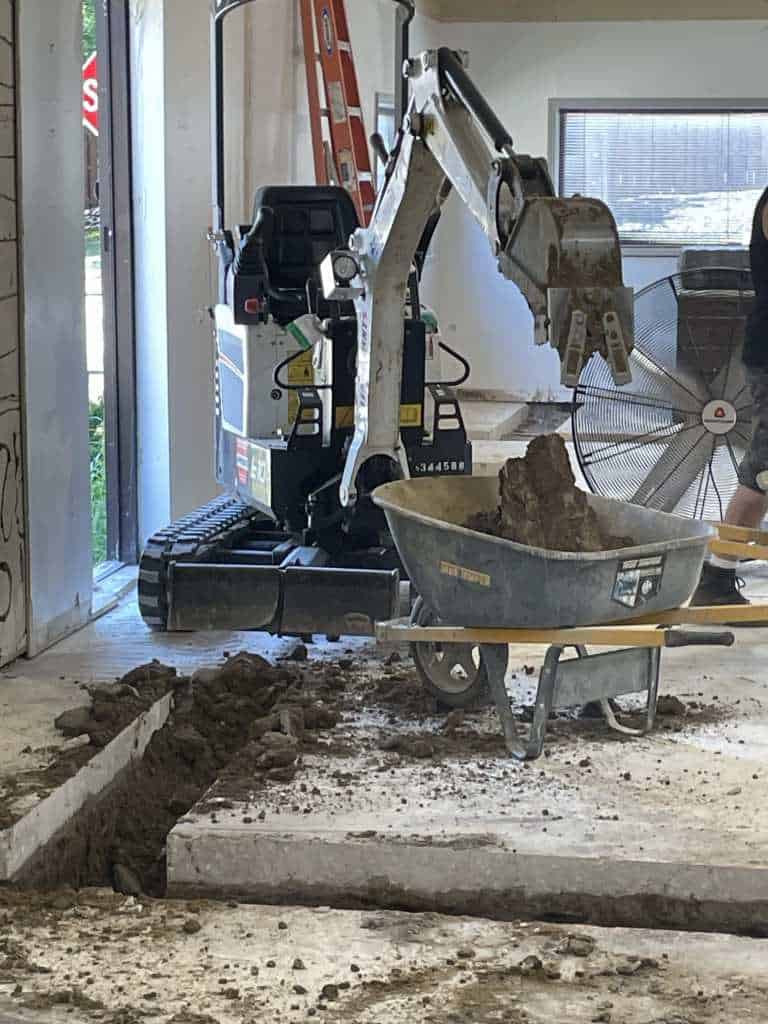 Excavation work in progress indoors.