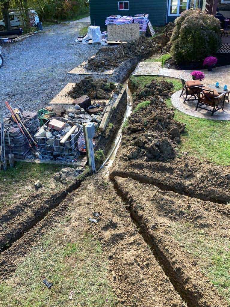 Excavated ground for utility installation.